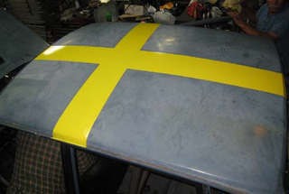 Illustration for article titled Black Metal V8olvo Now Equipped With Rebel Swedish Flag Roof